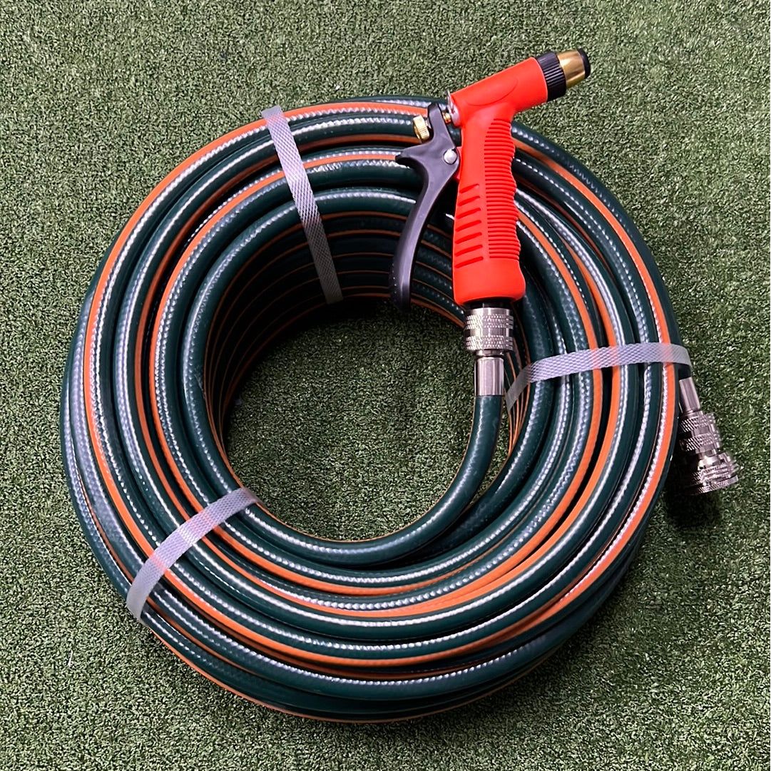 Hose Factory Gardeners Gift Set No 5 high-quality garden hose coiled with spray nozzle on a green background.