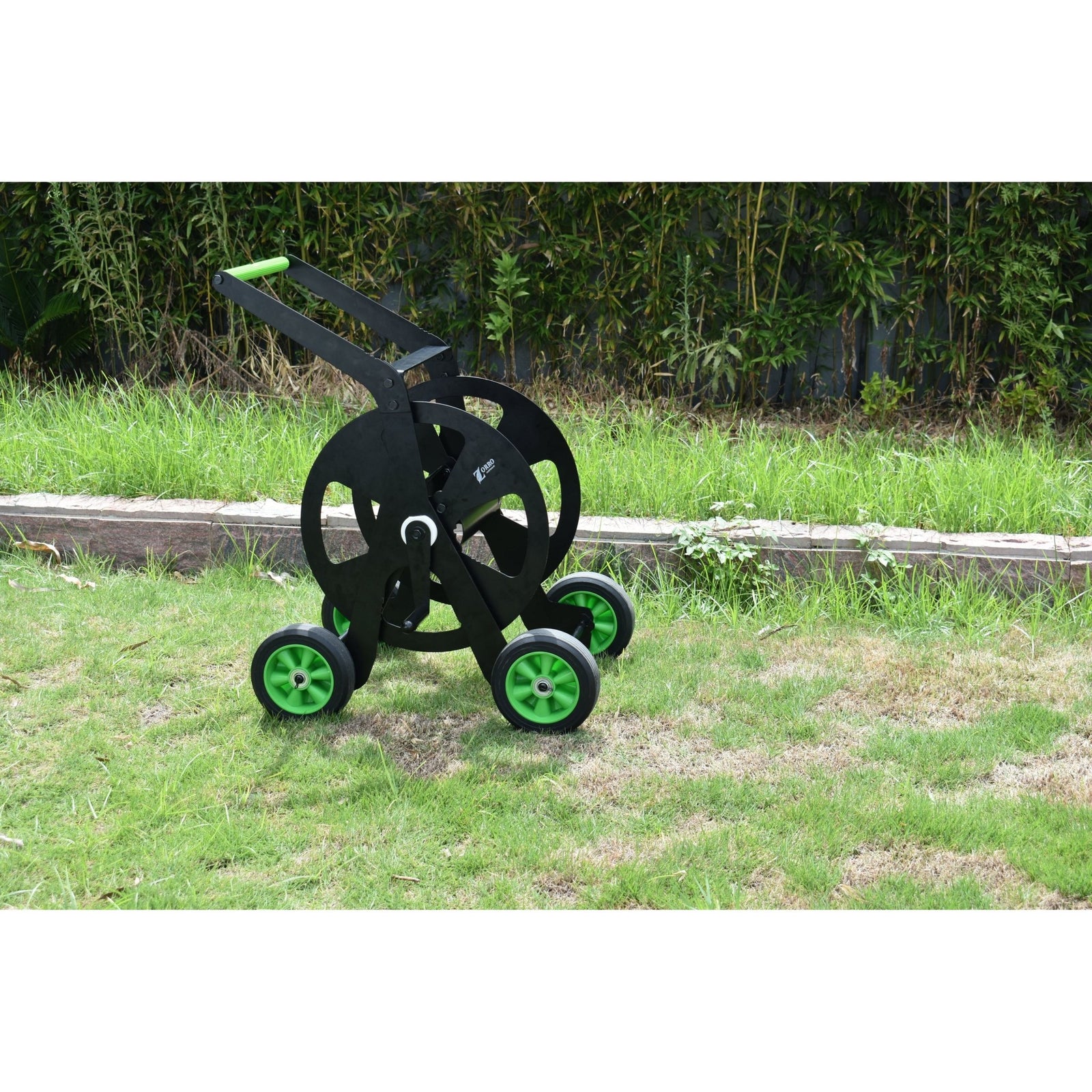 ZORRO Pro Industrial Hose Trolley and Proline Hose Bundle on green grass, showcasing durable design and mobility.