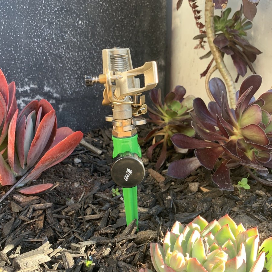 Zorro Zinc Impulse Adjustable Sprinkler on Green Spike - Hose Factory